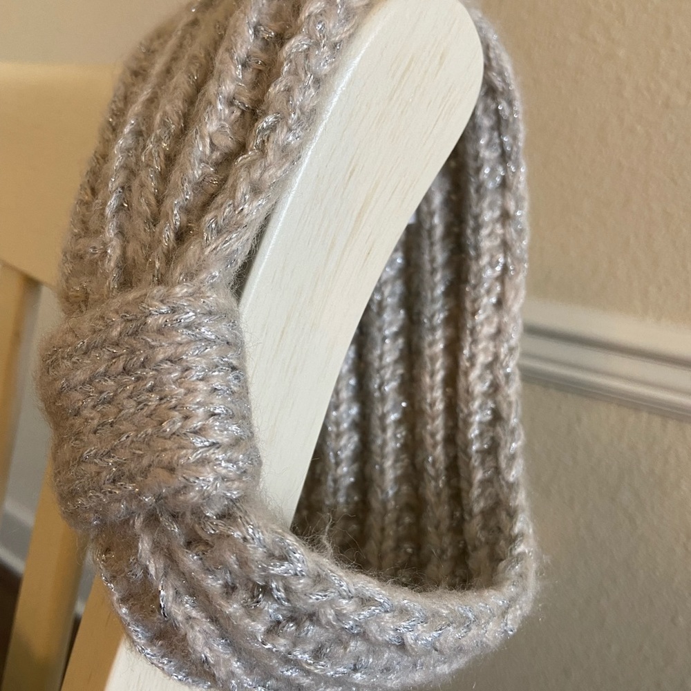 A silver sparkly crocheted headband.